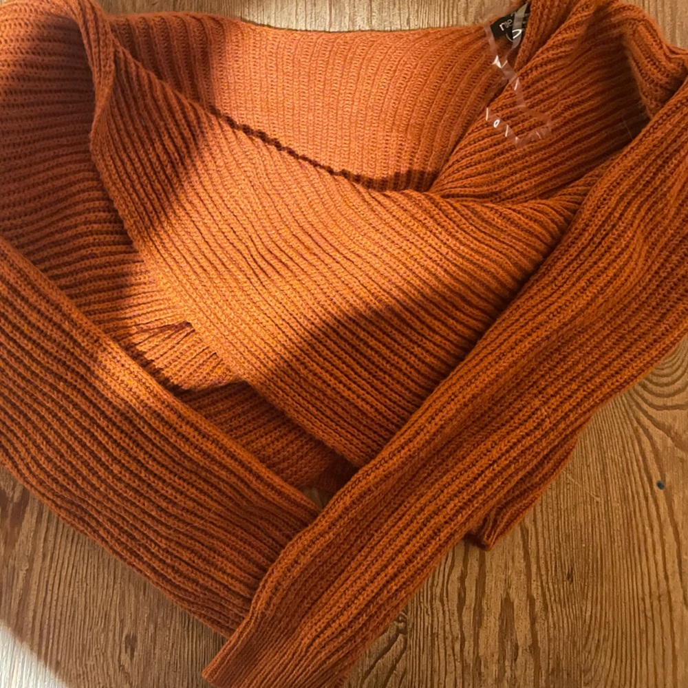 Pumpkin orange twist tie sweater.